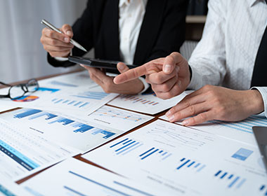 asian-businessmen-use-devices-for-business-holding-a-smartphone-and-discussing-administrative-data-analysis-marketing-and-financial-growth